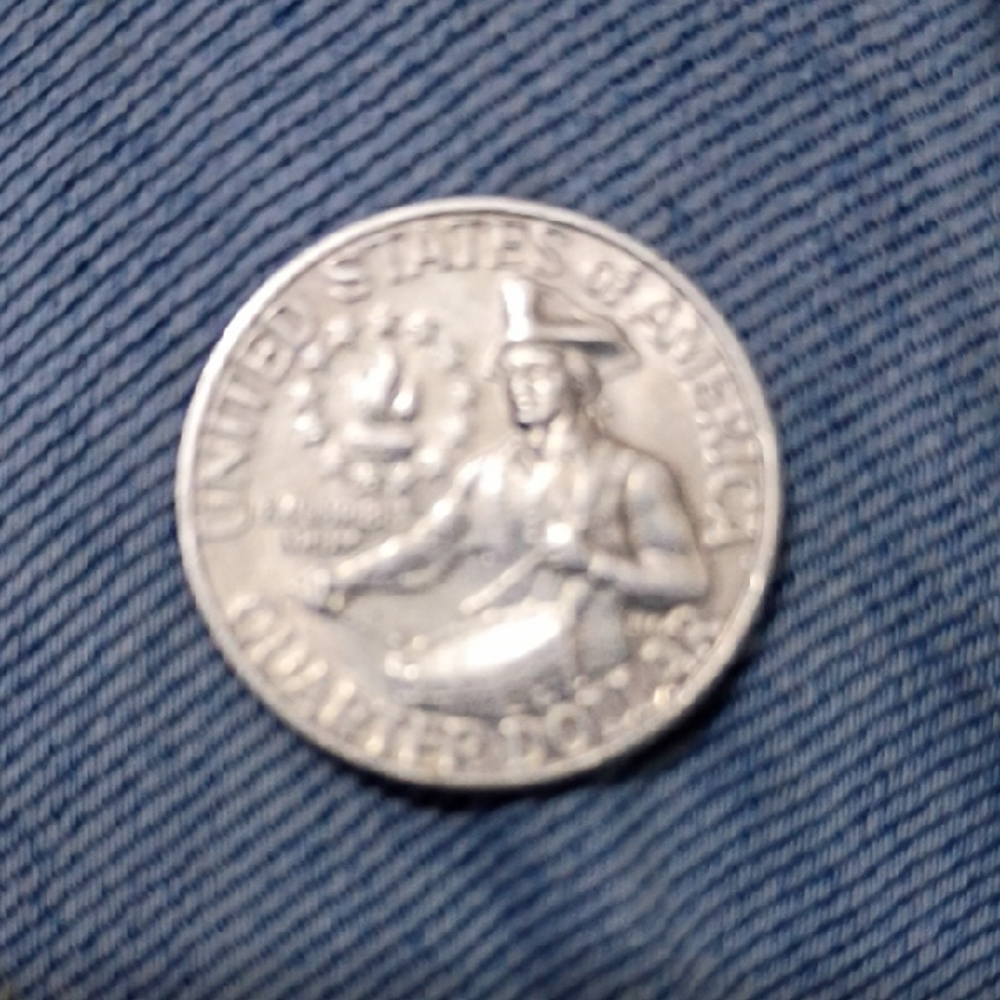 Rare Editions Silver Coin on Blue Fabric
